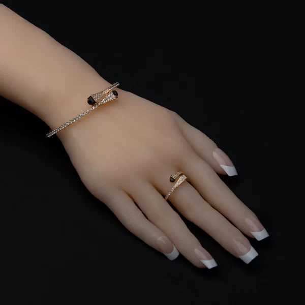 Golden bangle and ring with zircon and black stone