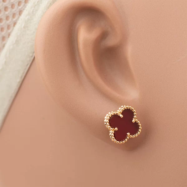 Golden plated earrings with maroon stone